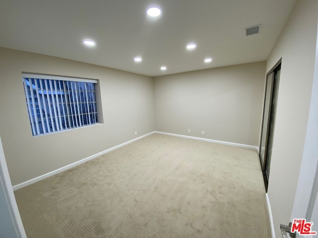 interior space featuring light carpet