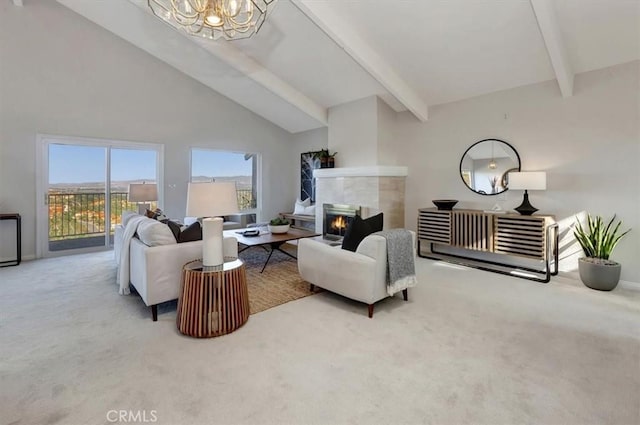 living area with a chandelier, light colored carpet, a fireplace, high vaulted ceiling, and beam ceiling