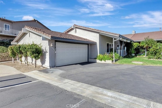 31146 Flying Cloud Dr, Laguna Niguel, CA 92677 - view of front of home featuring a garage, stucco siding, driveway, and a tile roof