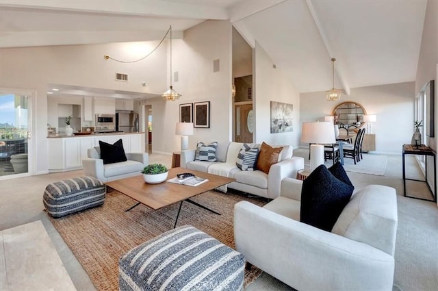 living area featuring high vaulted ceiling, light carpet, visible vents, baseboards, and beamed ceiling