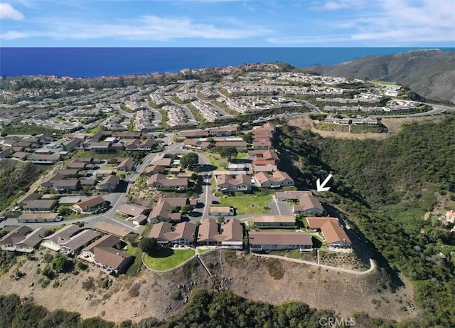 birds eye view of property with a residential view and a water view