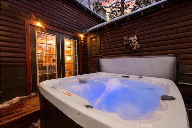 exterior space featuring a hot tub