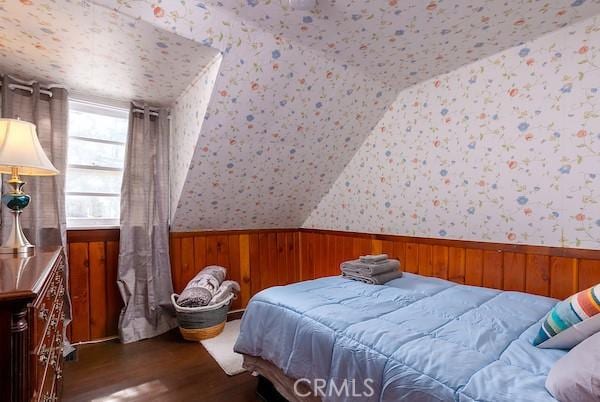 bedroom with dark hardwood / wood-style flooring