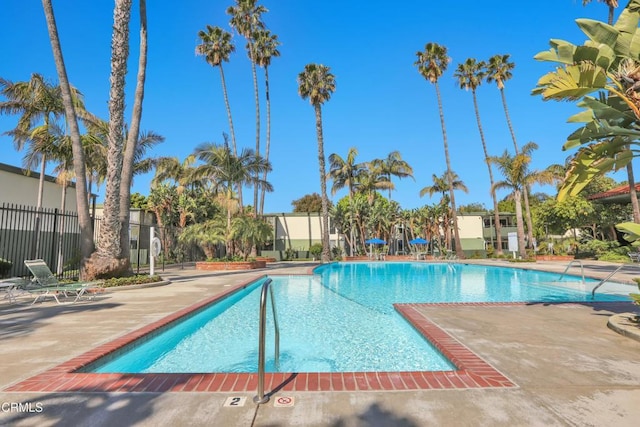 view of swimming pool with a patio area