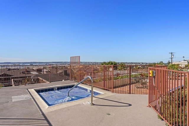 view of pool featuring a hot tub