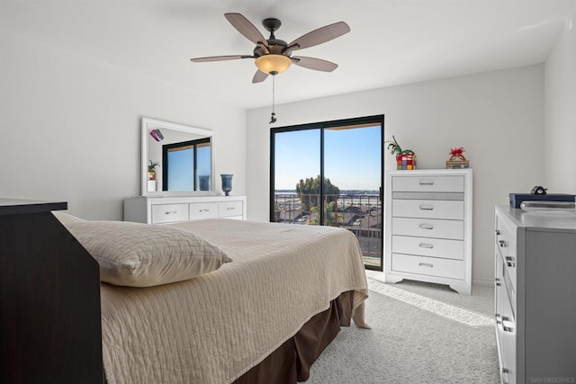 bedroom with ceiling fan and light carpet