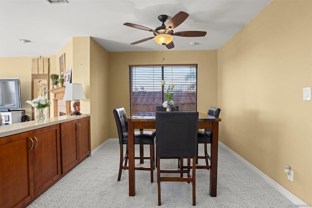 dining space with ceiling fan