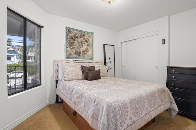 carpeted bedroom with a closet