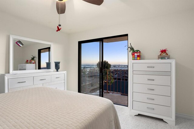 bedroom featuring ceiling fan and access to exterior