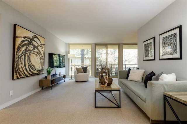 carpeted living room with floor to ceiling windows