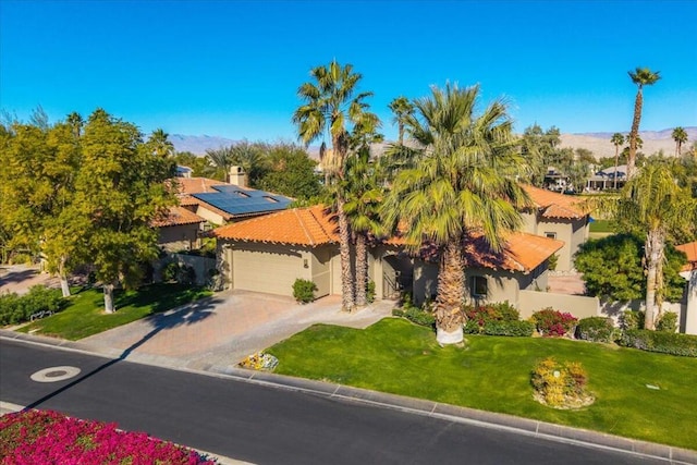 birds eye view of property with a mountain view