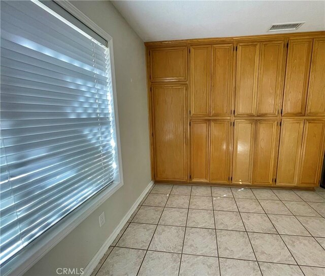 interior space featuring light tile patterned floors