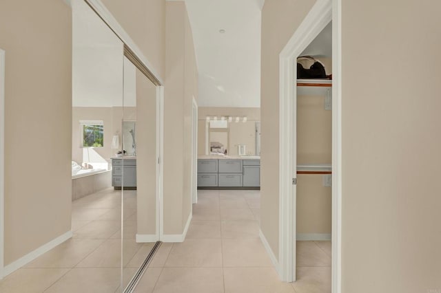 corridor featuring light tile patterned floors