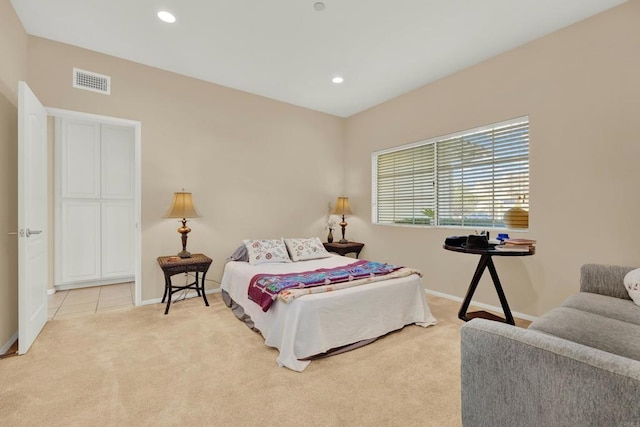 bedroom with light colored carpet