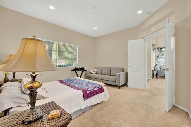 carpeted bedroom with multiple windows