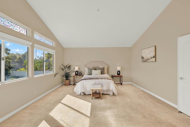 carpeted bedroom featuring high vaulted ceiling