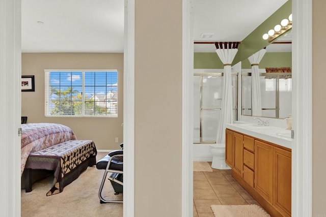 full bathroom featuring tile patterned flooring, vanity, enclosed tub / shower combo, and toilet