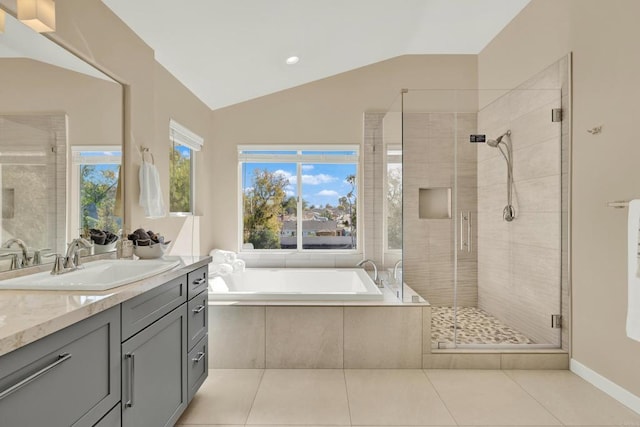 bathroom with vanity, lofted ceiling, tile patterned floors, and separate shower and tub