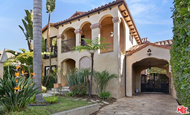 mediterranean / spanish-style house with a balcony