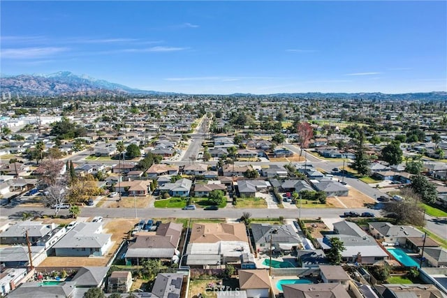 birds eye view of property featuring a mountain view