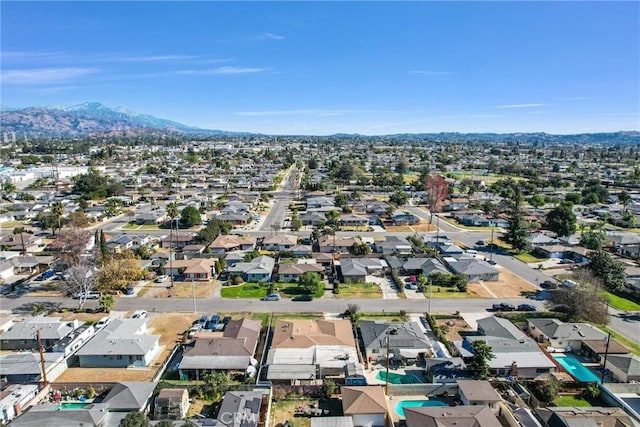 1307 N O Malley Ave, Covina, CA 91722 - aerial view of property's location featuring nearby suburban area and a mountain backdrop