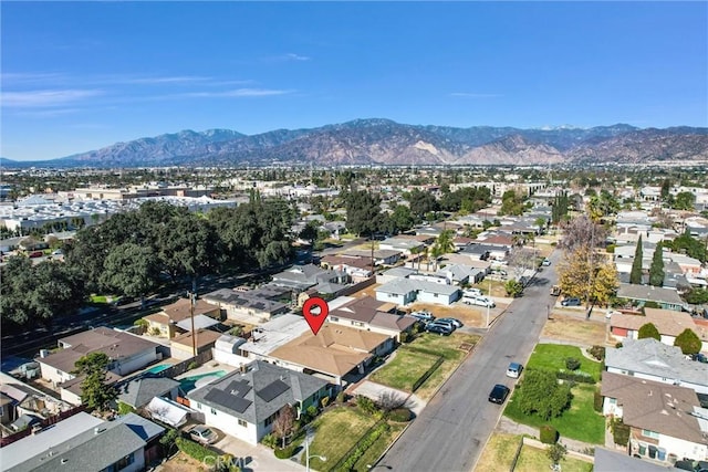 birds eye view of property featuring a mountain view