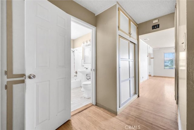 hall featuring light hardwood / wood-style flooring