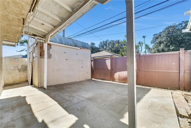 view of patio / terrace with a shed