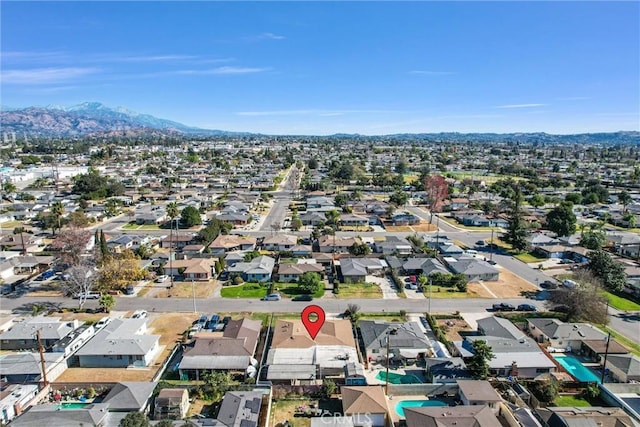 drone / aerial view featuring a mountain view