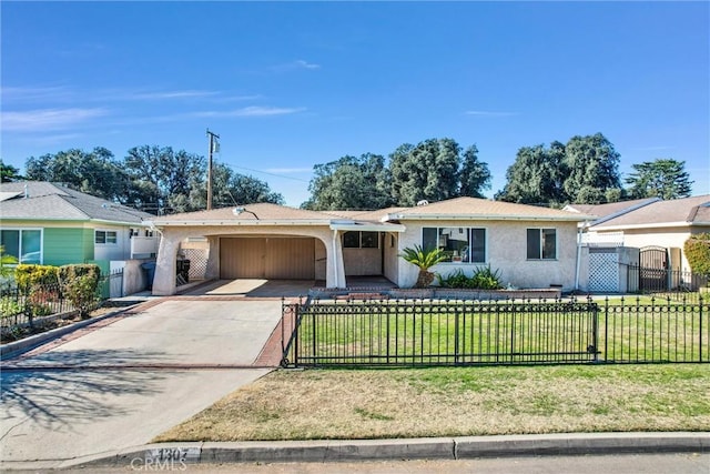 ranch-style house featuring a front yard and a garage