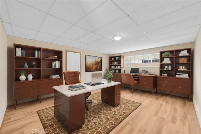 1307 N O Malley Ave, Covina, CA 91722 - home office featuring light wood finished floors, a paneled ceiling, and built in features