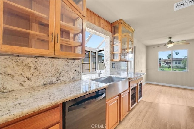 1307 N O Malley Ave, Covina, CA 91722 - kitchen featuring dishwasher, light wood-style floors, a sink, light stone countertops, and tasteful backsplash