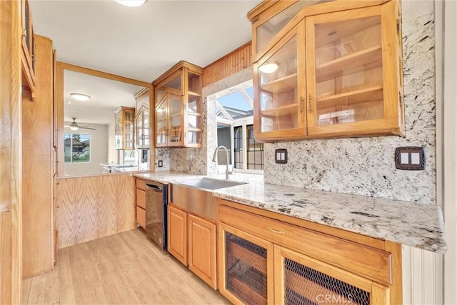 1307 N O Malley Ave, Covina, CA 91722 - kitchen with dishwasher, decorative backsplash, light stone counters, light wood-style floors, and a sink