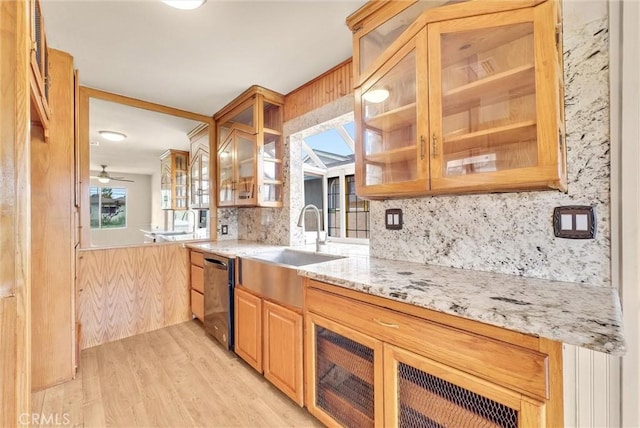 1307 N O Malley Ave, Covina, CA 91722 - kitchen with stainless steel dishwasher, decorative backsplash, light stone counters, light wood-style flooring, and glass insert cabinets