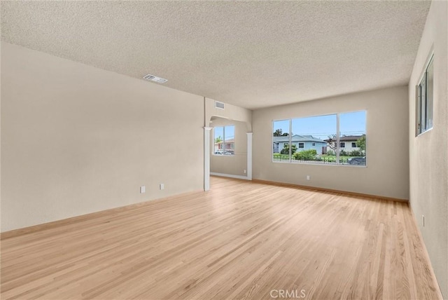 1307 N O Malley Ave, Covina, CA 91722 - spare room featuring light wood-type flooring and a textured ceiling
