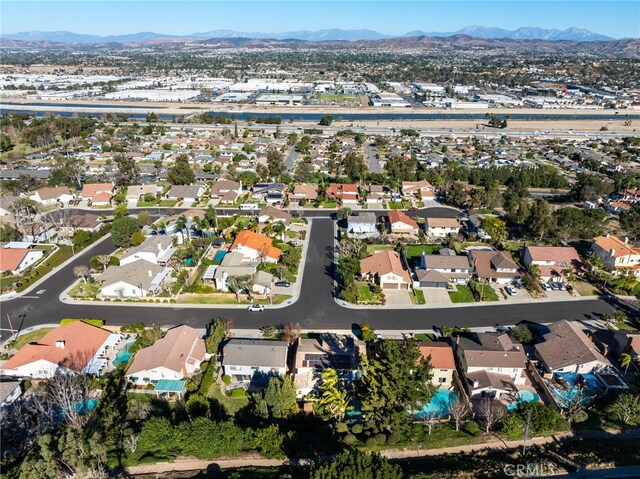 birds eye view of property featuring a mountain view