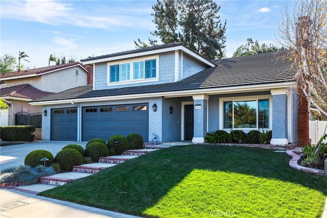 front of property featuring a garage and a front yard