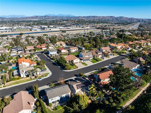 birds eye view of property with a mountain view