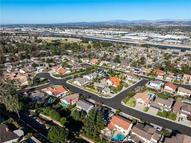 birds eye view of property featuring a mountain view