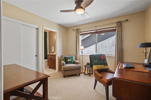 office area with ceiling fan and light colored carpet