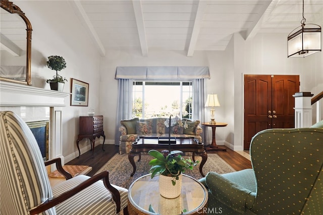 living room with wooden ceiling, beam ceiling, hardwood / wood-style floors, and a tile fireplace