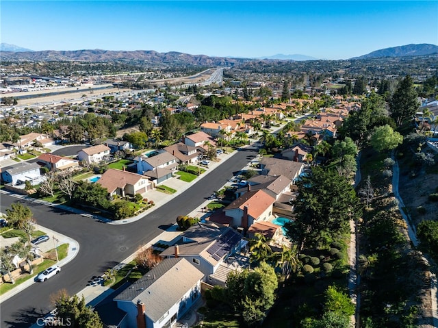 birds eye view of property with a mountain view