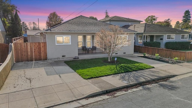 view of front of home with a lawn