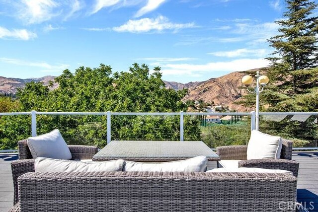 view of patio / terrace featuring a balcony and a mountain view