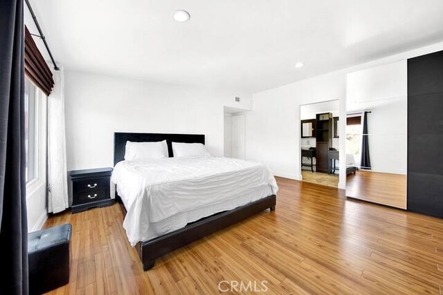 bedroom featuring hardwood / wood-style floors