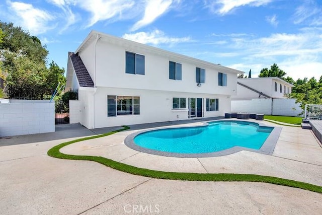 view of pool featuring a patio