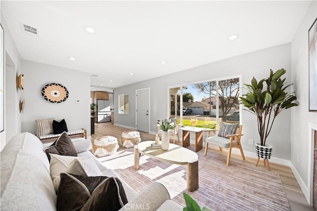 living room with light hardwood / wood-style floors