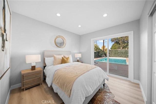 bedroom featuring light hardwood / wood-style floors and access to outside