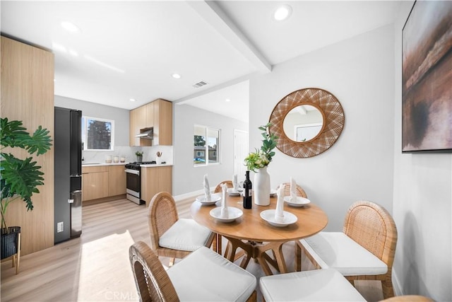 dining area with light wood-type flooring