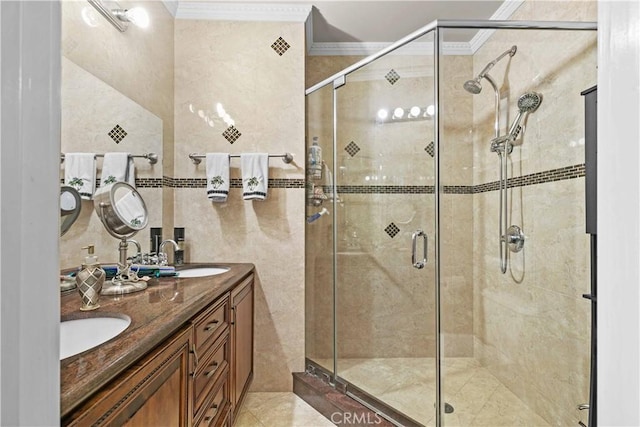 bathroom featuring tile walls, vanity, crown molding, and a shower with shower door